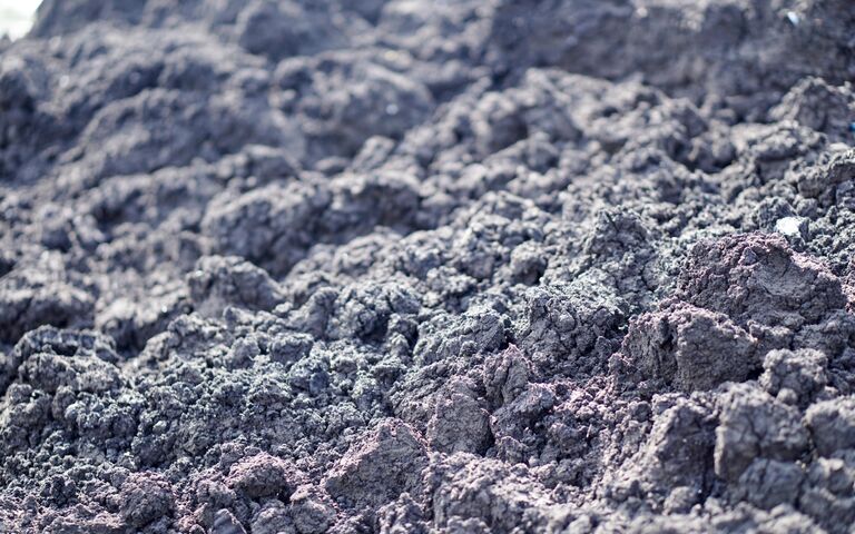 Dewatered sludge solids: large lumps of sludge formed from the removal of water from raw sewage sludge